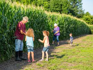 Image of a family at their corn farm